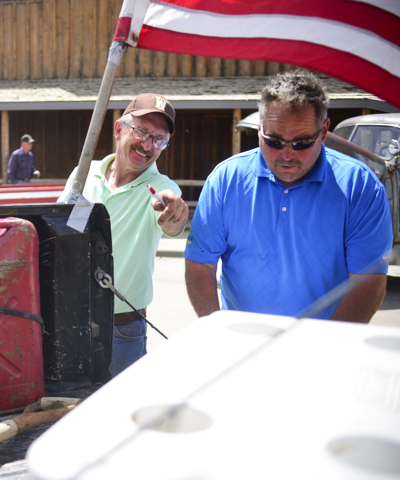 Tom Knapp points out his favorite elements of a truck to fellow judge Dave Straub